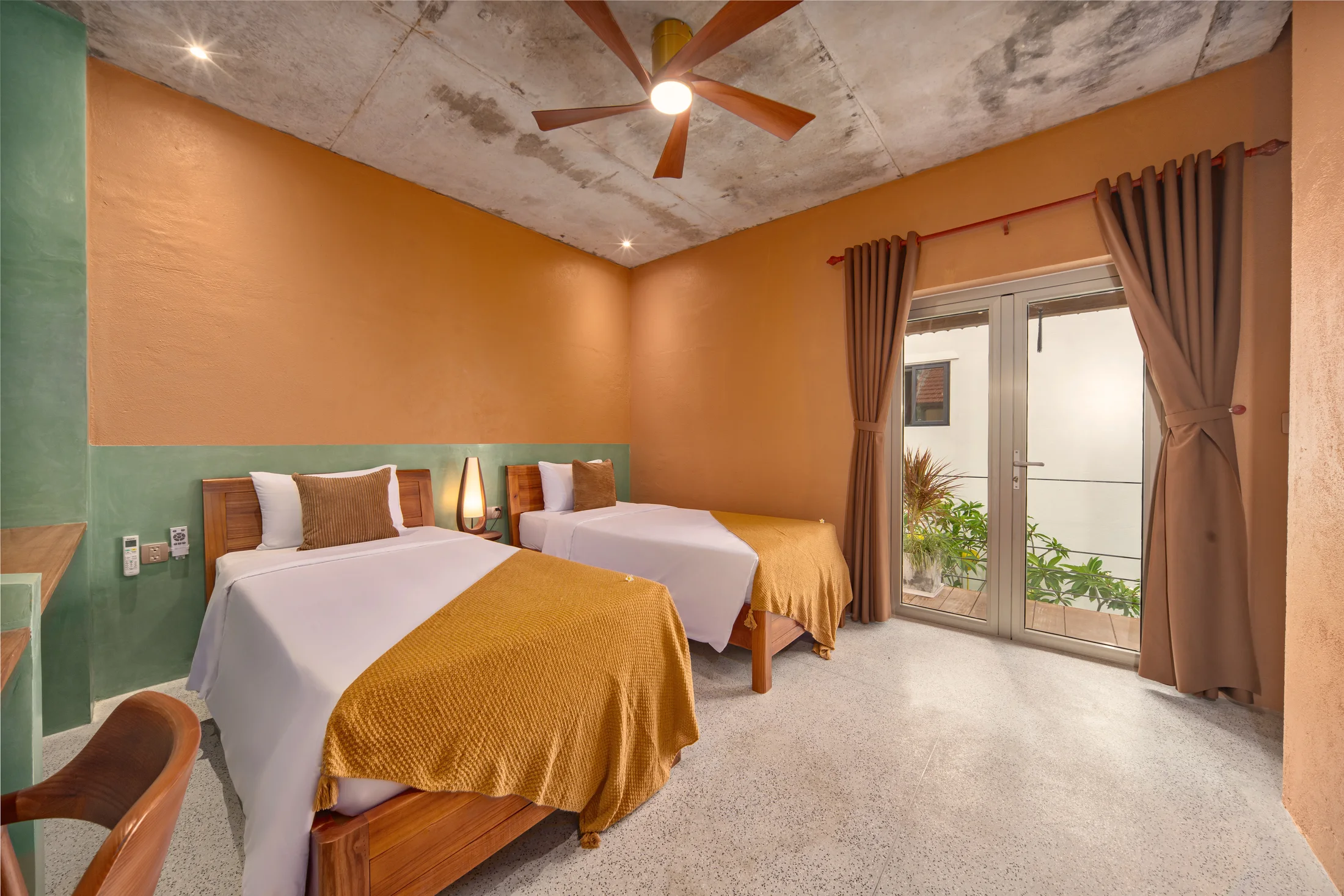 Twin bedroom with two single beds and courtyard doors